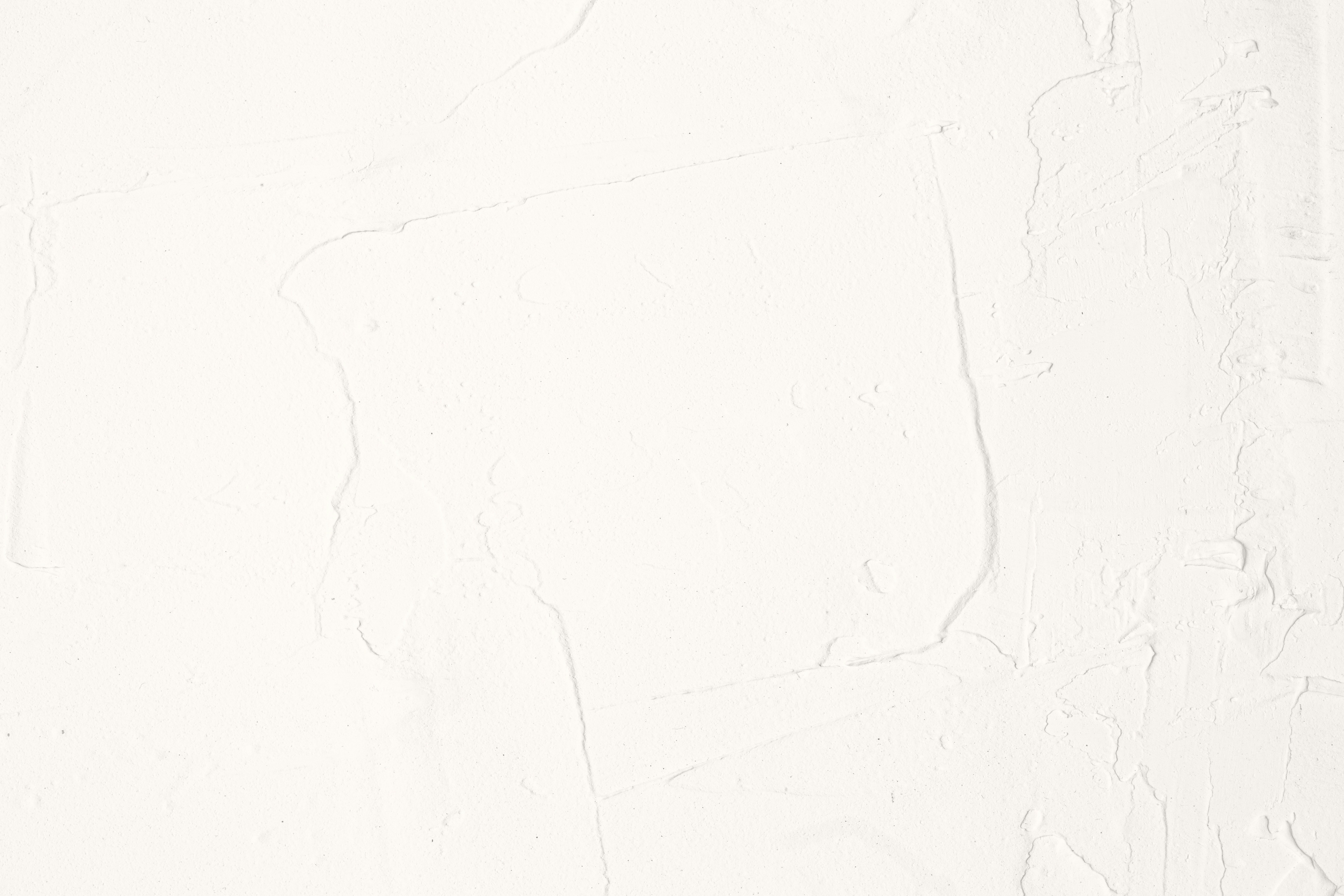 A white wall with a black and white clock on it